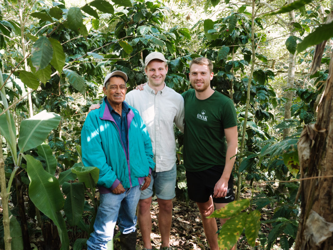 Buy organic coffee from ØNSK- Founderds Rasmus and Andreas standing with coffee farmer in Nicaragua